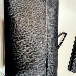 Tory Burch black large wallet with many compartments.